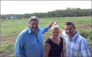 Steve Davis, Karen Williamd and Andrew Laming hamming it up on the Commonwealth lands in Birkdale.